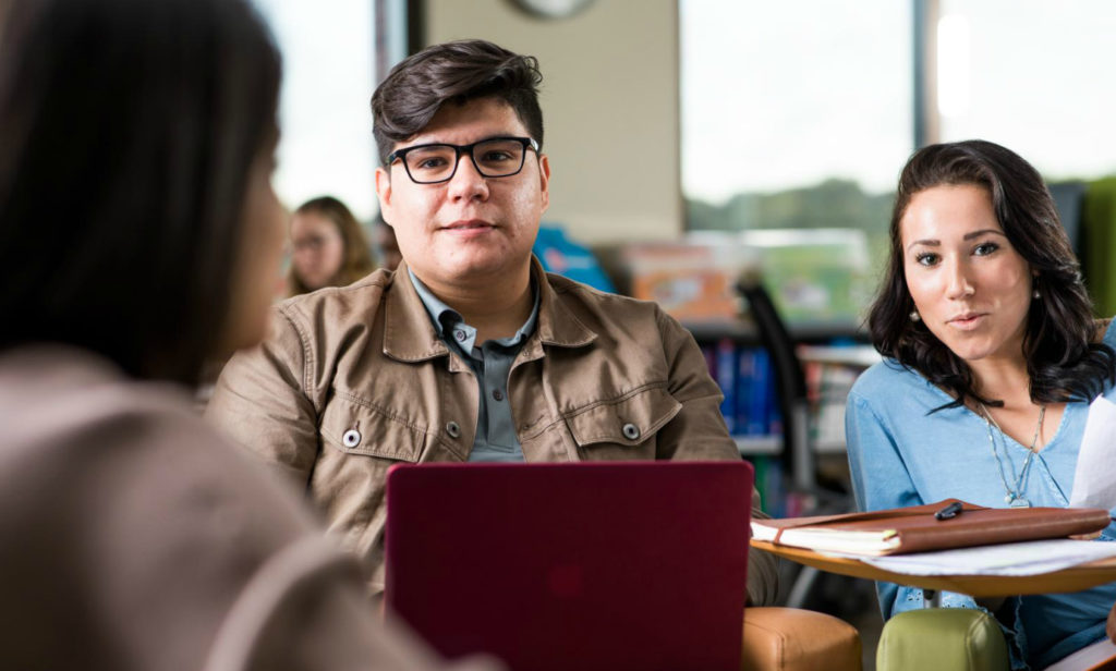 students having conversation in classroom