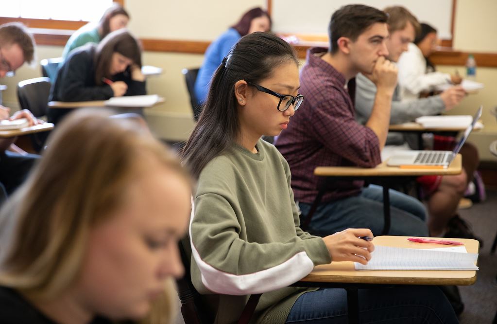 students sitting at desks in a classroom